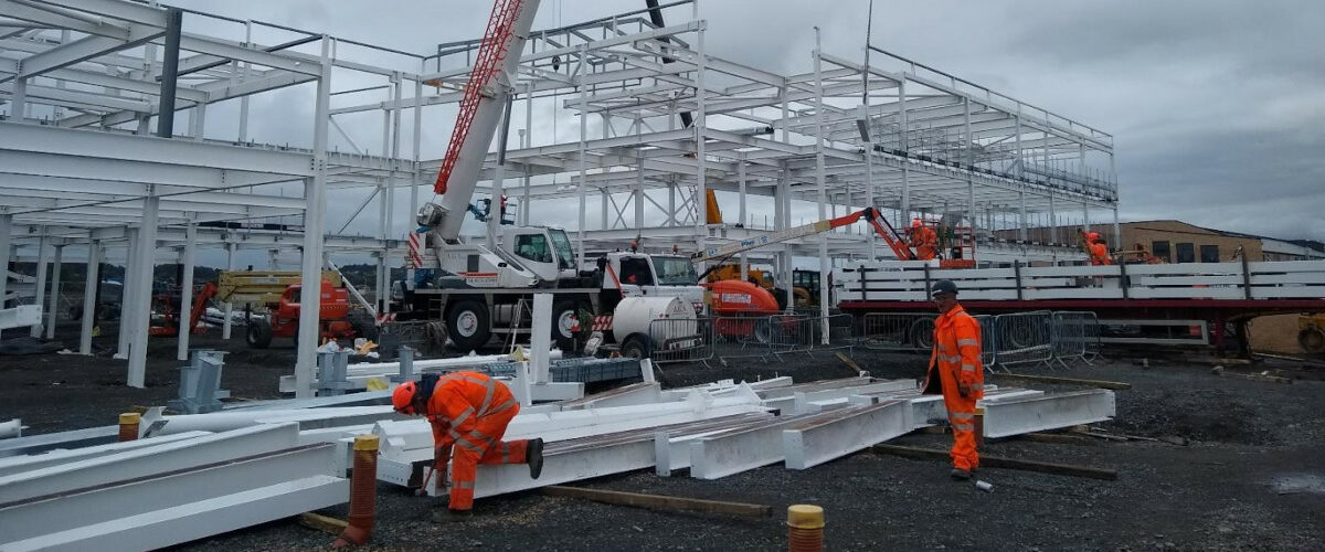 Working building site with white steel framework construction